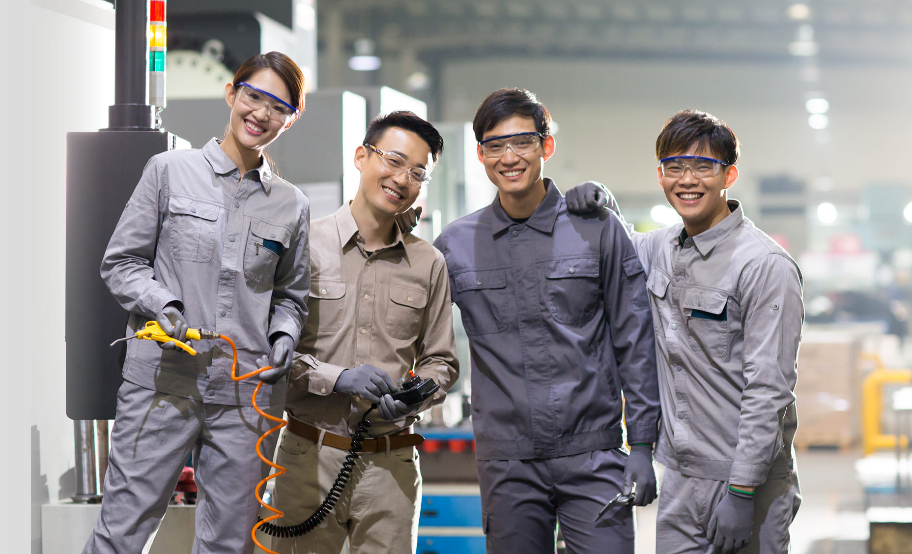 Industrial technicians collaborating on a plant floor